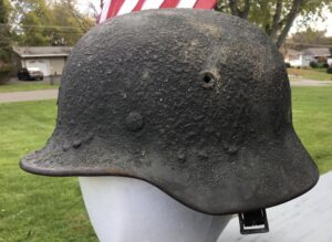 M40 HELMET WITH EXCEPTIONALLY HEAVY CAMOUFLAGE