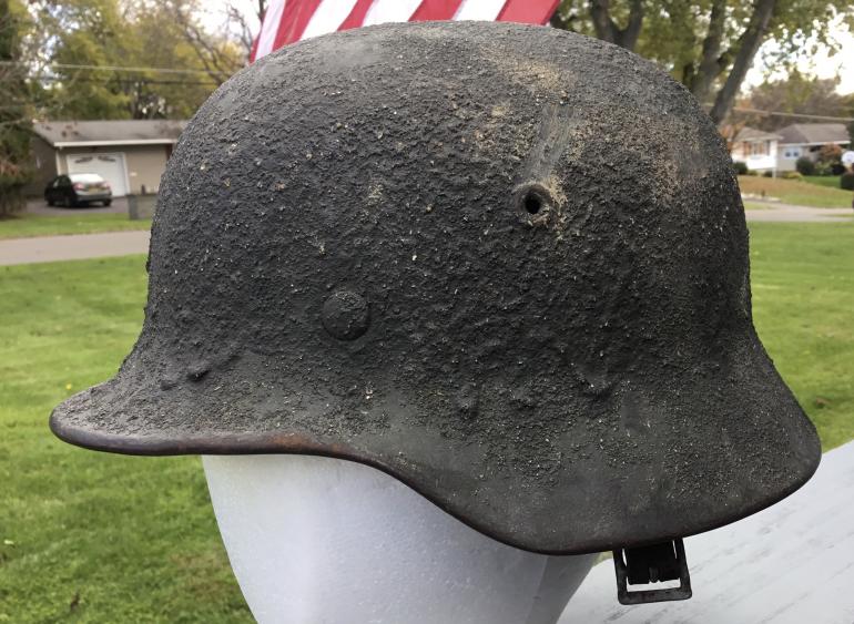 M40 HELMET WITH EXCEPTIONALLY HEAVY CAMOUFLAGE